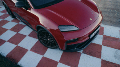 Front view of Porsche Macan GTS Electric in Lugano Blue with black accents